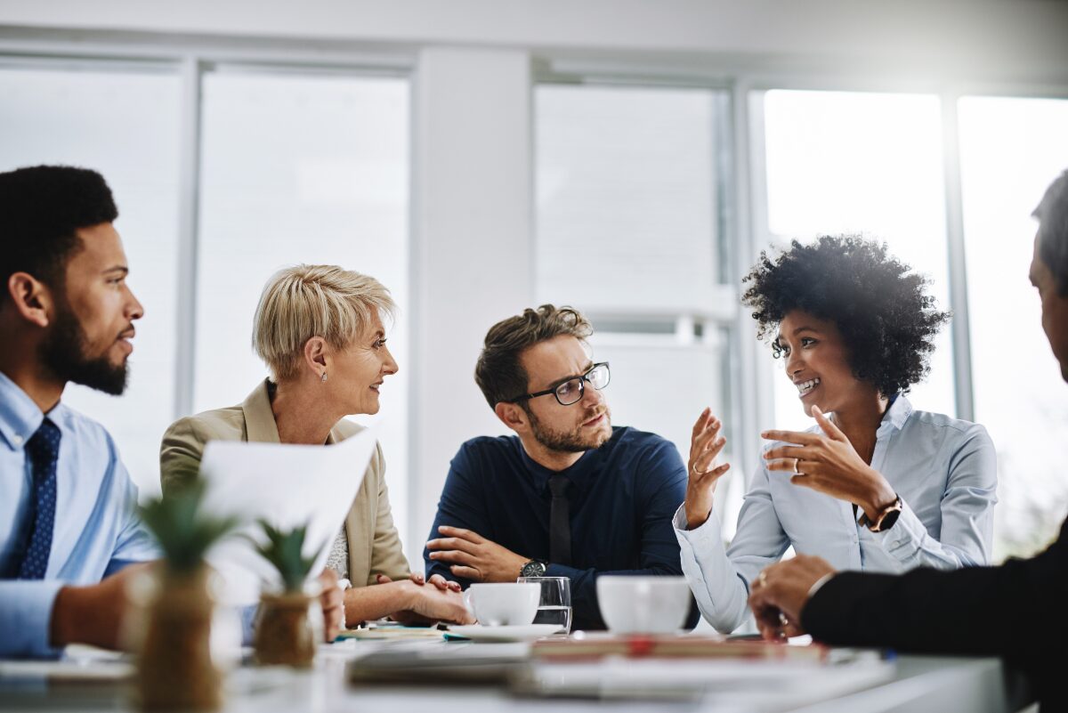 colleagues having a discussion at a table