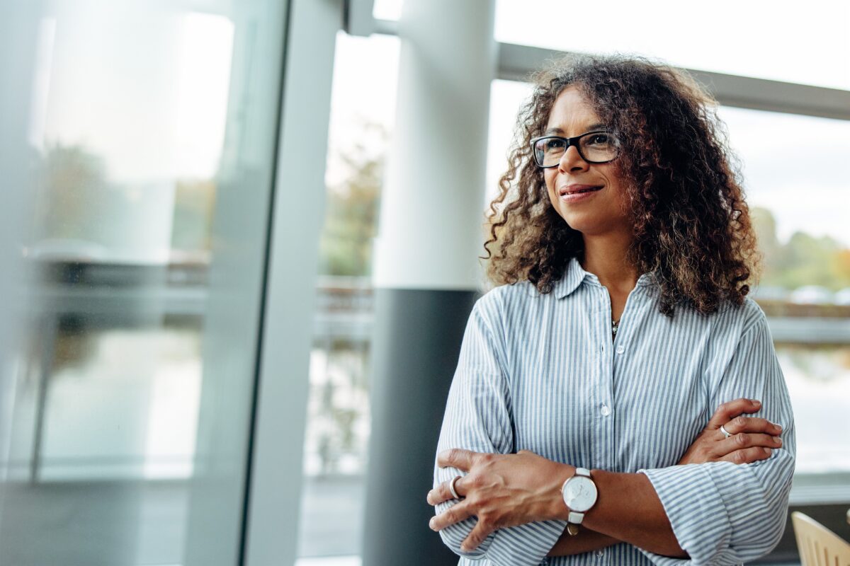 confident-woman-professional-staring-out-window