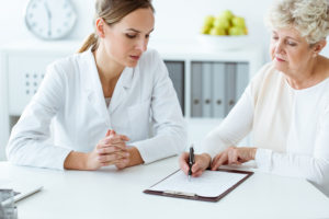 Two woman going through Joint Commission patient safety consulting