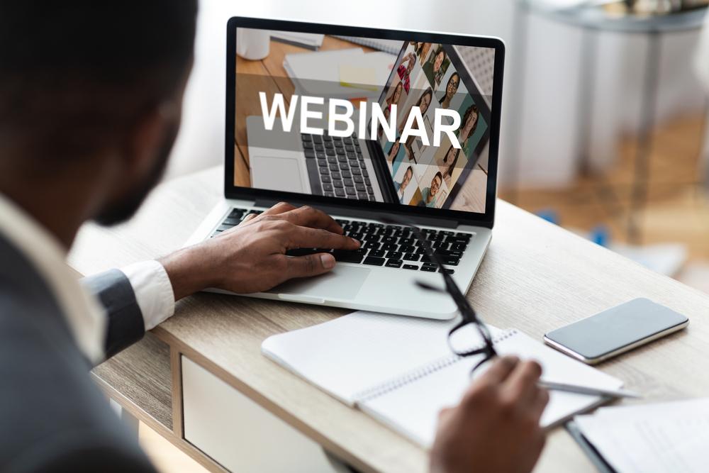 male-watching-webinar-on-computer