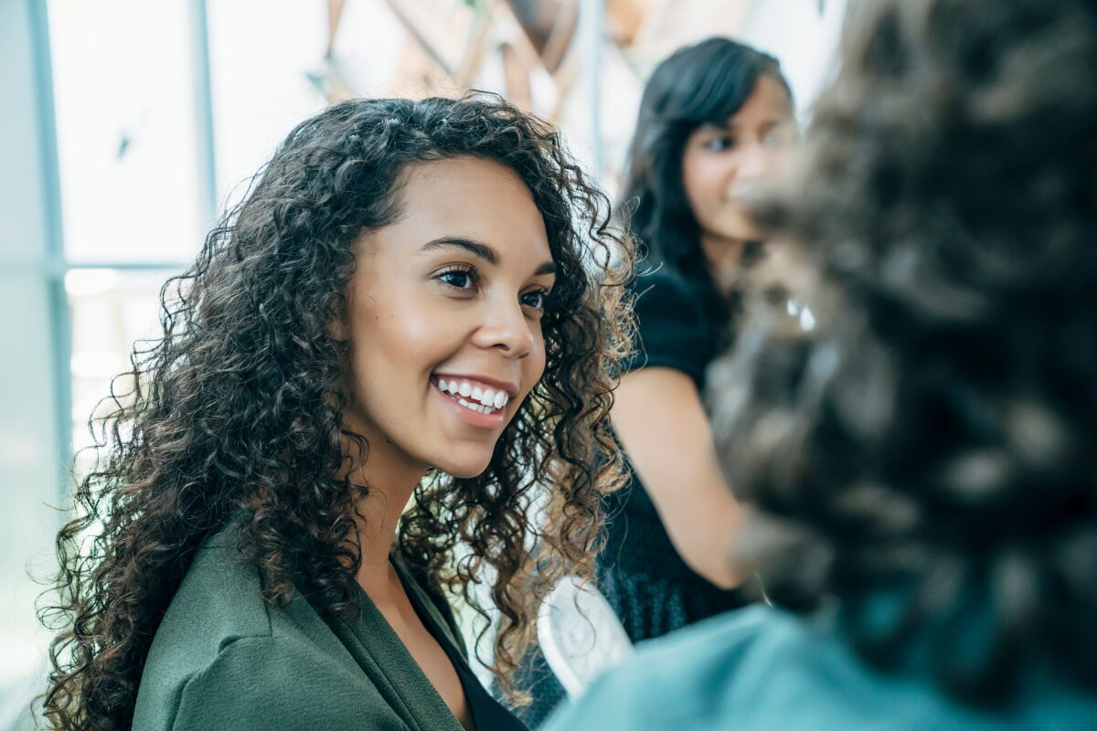 woman-smiling-discussion-networking